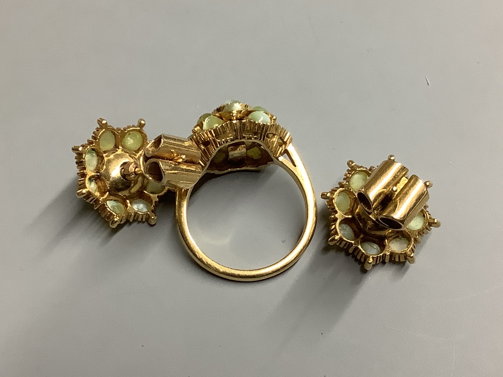 A yellow metal and cat's eye chrysoberyl? cluster ring and a pair of similar earrings
